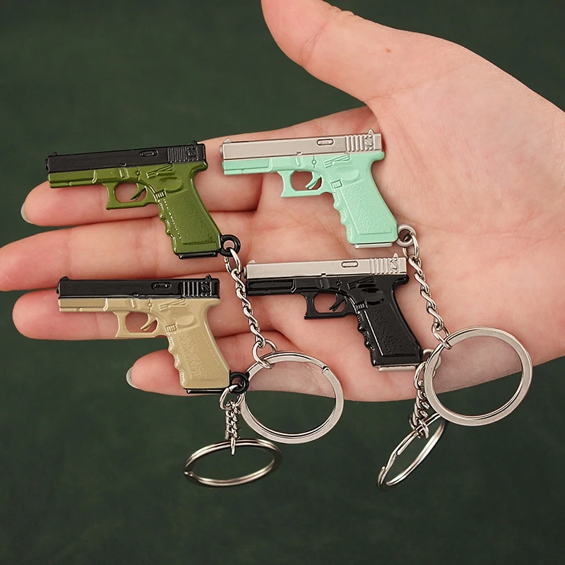 

Tot Gun Keychain Alloy Weapon G17 P18C Mini Full Metal Model Game Periphery Light Key Chain Pistol Toy Birthday Gifts for kids