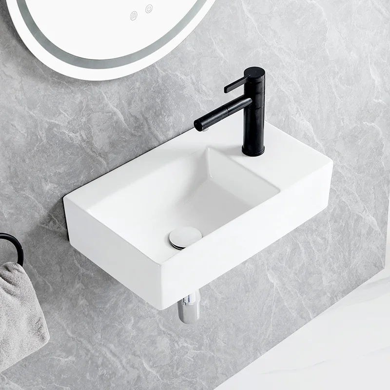 Wall-mounted wash basin with modern and elegantly designed bathroom sink for hotel and commercial restrooms