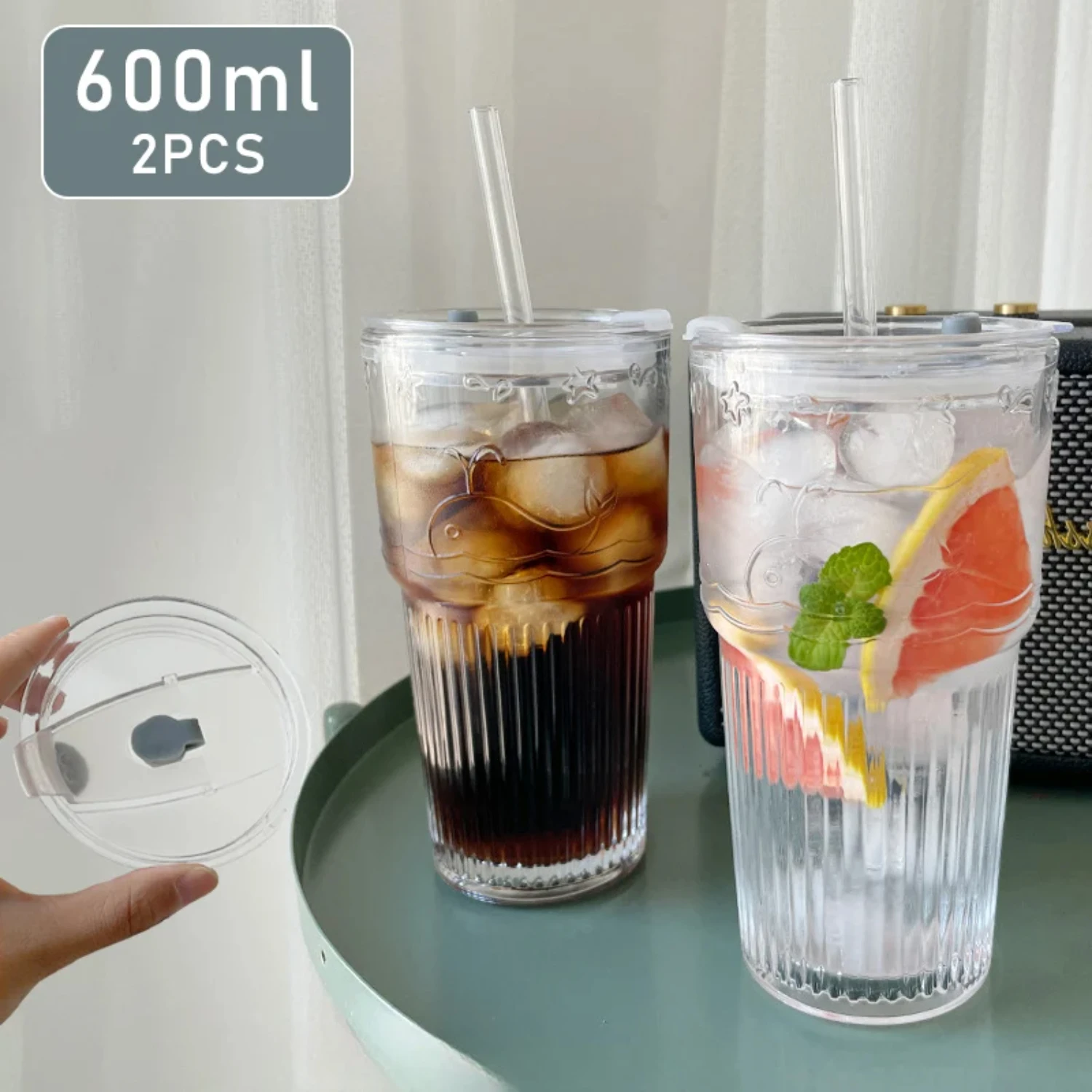 Stunning and sophisticated, this set of 2 elegant transparent striped glass cups with matching lids and straws is a must-have. F - Product Main Image