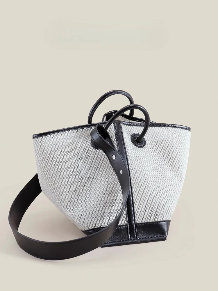 

Niche commuter woven tote bag, large-capacity mother and child women's bag, high-end shoulder handbag.