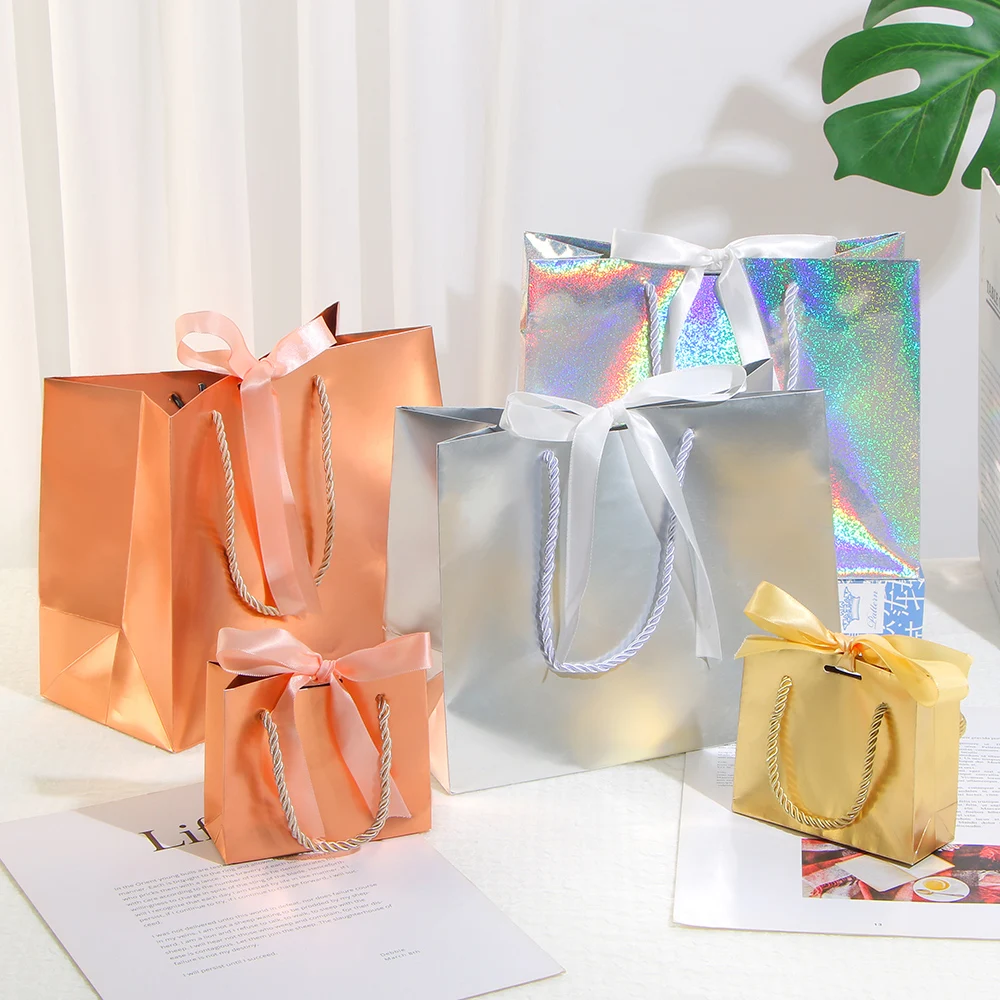 Laser gift paper bag holiday party gold and silver packaging carton ribbon small paper bag