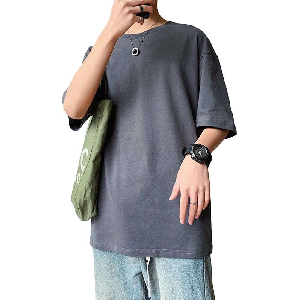 การออกนอกบ้านแบบสบาย ๆ ใช้ทุกวันเสื้อยืดแขนสั้นสีดําเสื้อผ้าทรงหลวมลําลองแขนสั้นลายสีทึบ