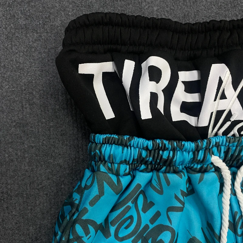 Los Pantalones anchos de doble cintura están de moda, vanguardistas, superpersonalizados y falsos de dos piezas con patrón fluorescente