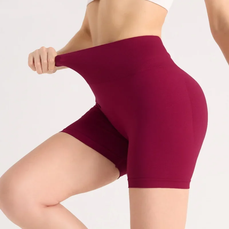 Shorts de ioga apertados para exercícios de secagem rápida com quadril pêssego sem costura