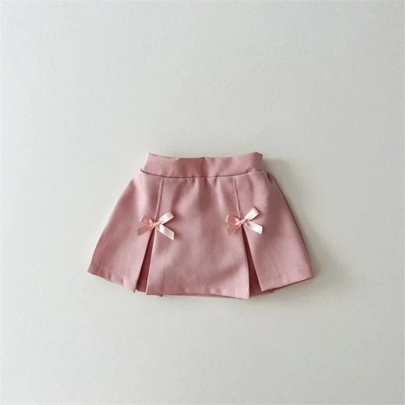 Korean version of spring and autumn girls' cute cotton pleated bow, solid color, fashionable and versatile pleated skirt