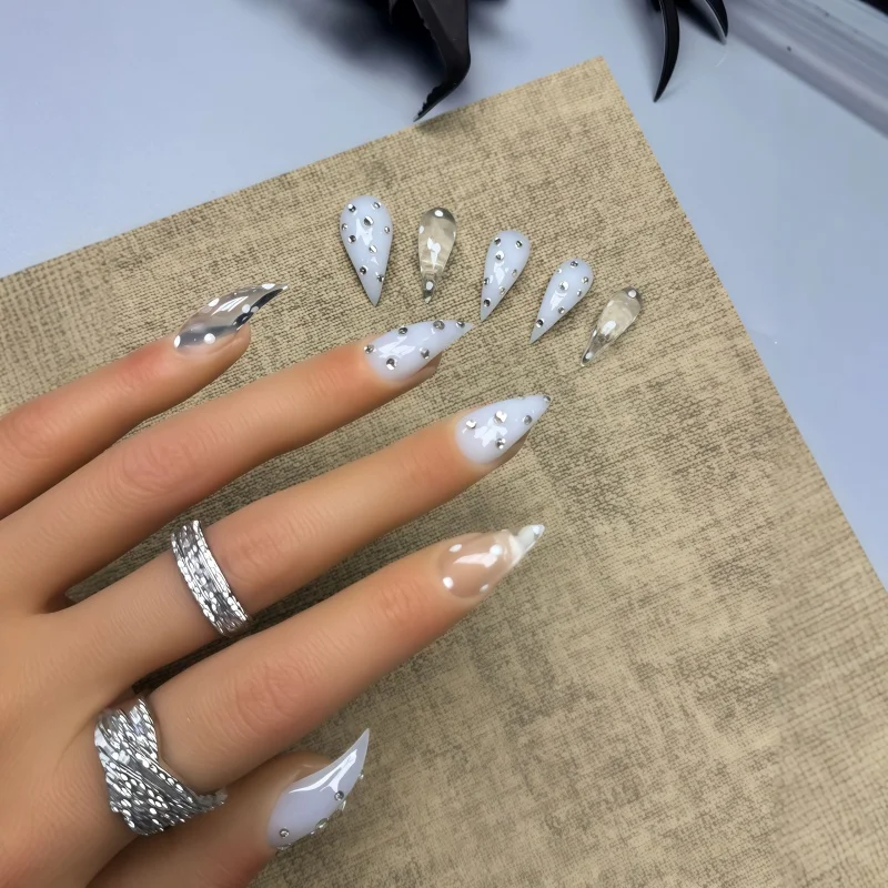10PCS of cream-colored pointed nail stickers, with hand-painted white dots as decorations, paired with mini silver rhinestones