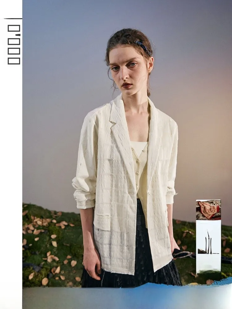 

Шерстяной костюм свободного кроя с вырезами и квадратным узором от Nippon Wearing для делового и повседневного использования