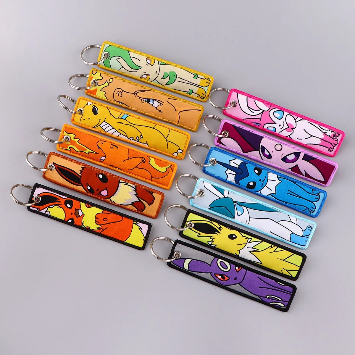 LLavero de Pokémon con marca tejida, accesorio de tejido artístico de Anime, gran oferta, en stock