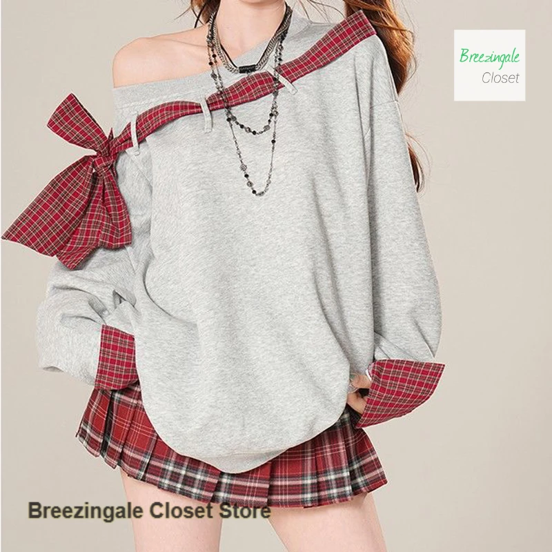 

French-style tie bow off diagonal shoulder sweater women's spring and autumn new black loose stitching plaid long-sleeved top.