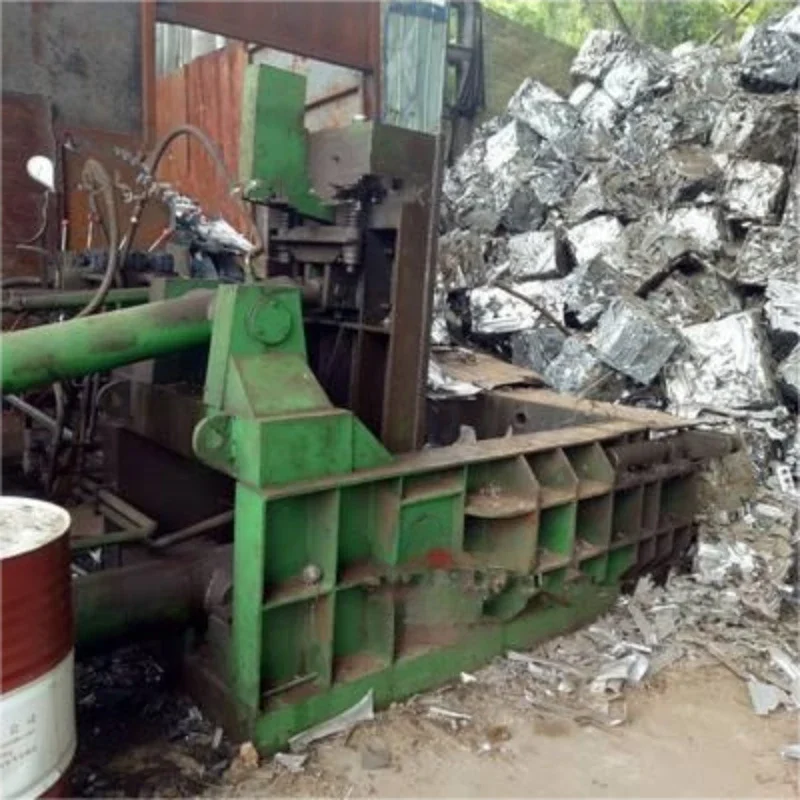 Horizontal scrap metal baler