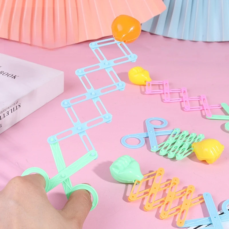 

Scissors elastic fist gun, funny toy magic elastic spring retractable gun