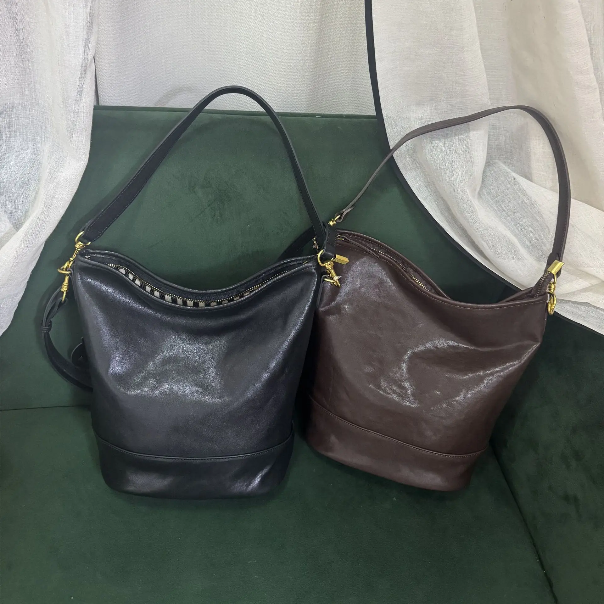 

Сумка-ведро на одно плечо из воловьей кожи растительного дубления 2025 года. Универсальная и высококачественная нишевая сумка через плечо в корейском стиле.