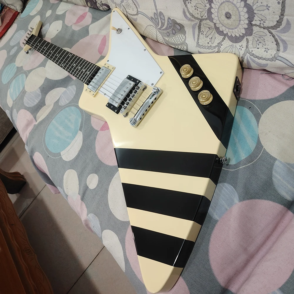 High quality milky yellow shaped electric guitar with black lines on the body, available for quick delivery