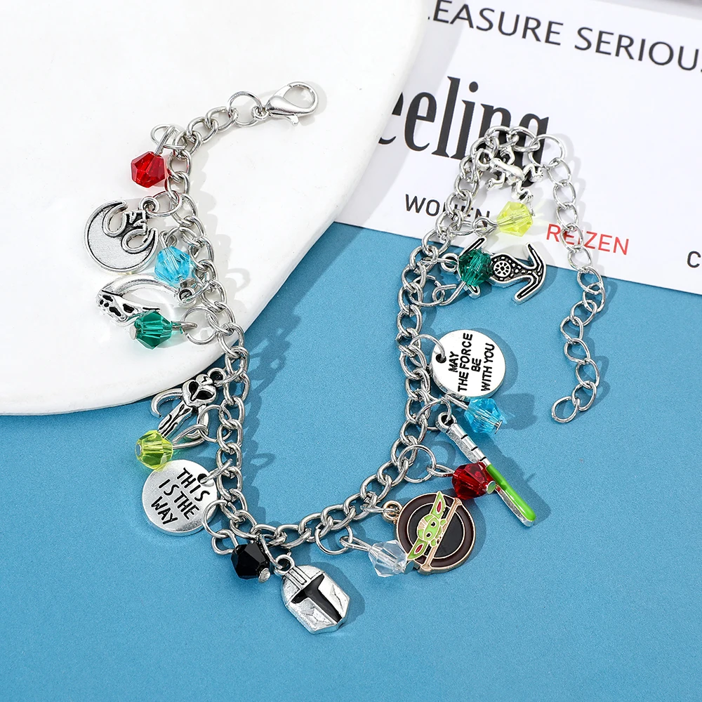 Star Wars Fan Jewelry the Mandalorian Inspired Charm Bracelet with Grogu Mythosaur Skull And Lightsaber Details Sci-Fi Accessory - view 4