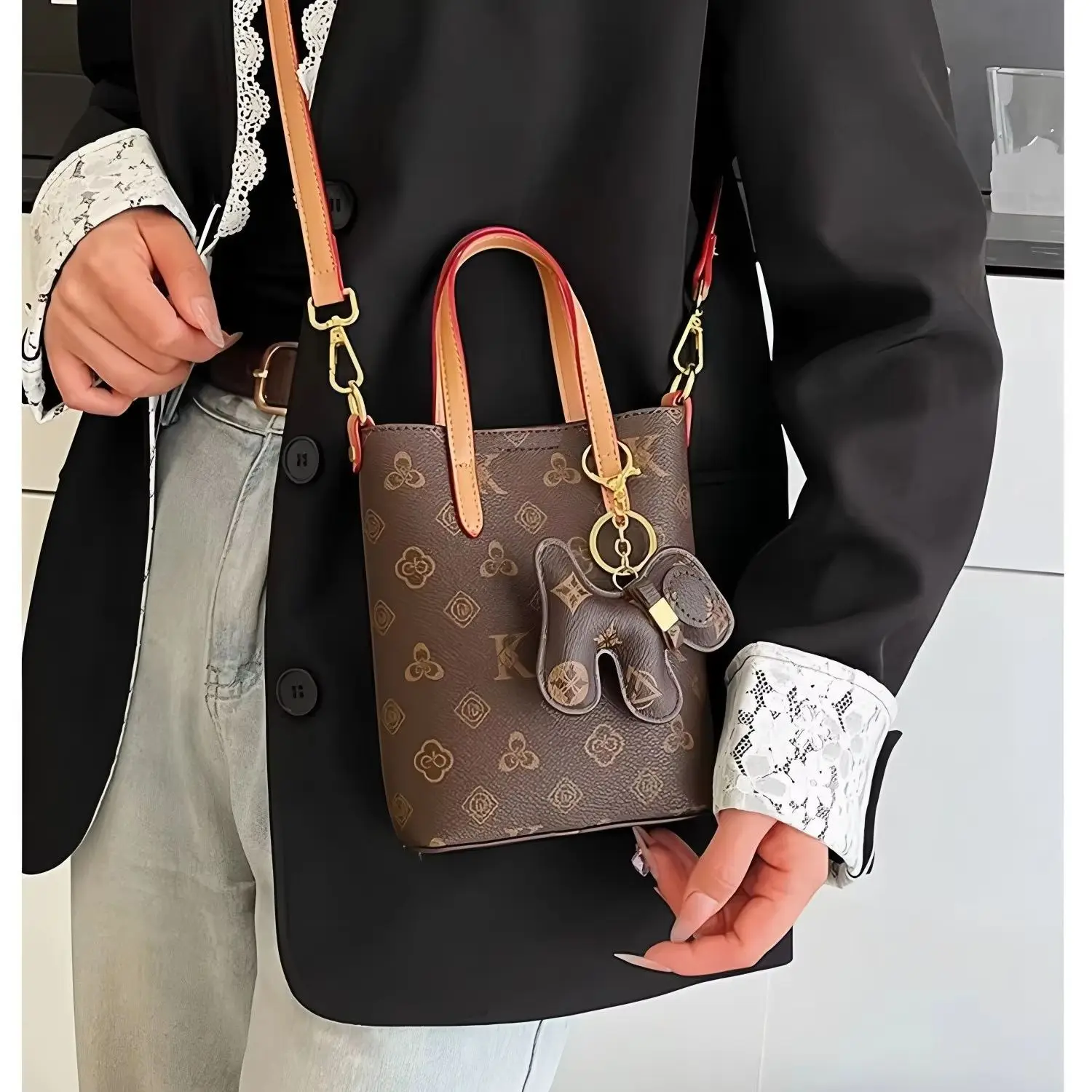 Retro letter pattern mini tote crossbody bag with leather handle, adjustable and removable shoulder strap, and cute horse-shaped charm decoration.