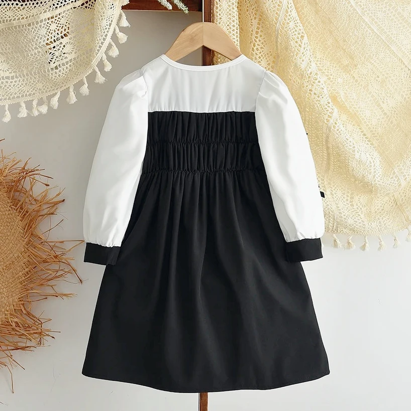ชุดเดรสลำลองเด็กผู้หญิง สไตล์มินิมอล สีดำขาว สำหรับเด็กอายุ 3-7 ปี รุ่นใหม่ประจำฤดูใบไม้ร่วง ดีไซน์ตัดสี แต่งโบว์ แฟชั่นทันสมัย