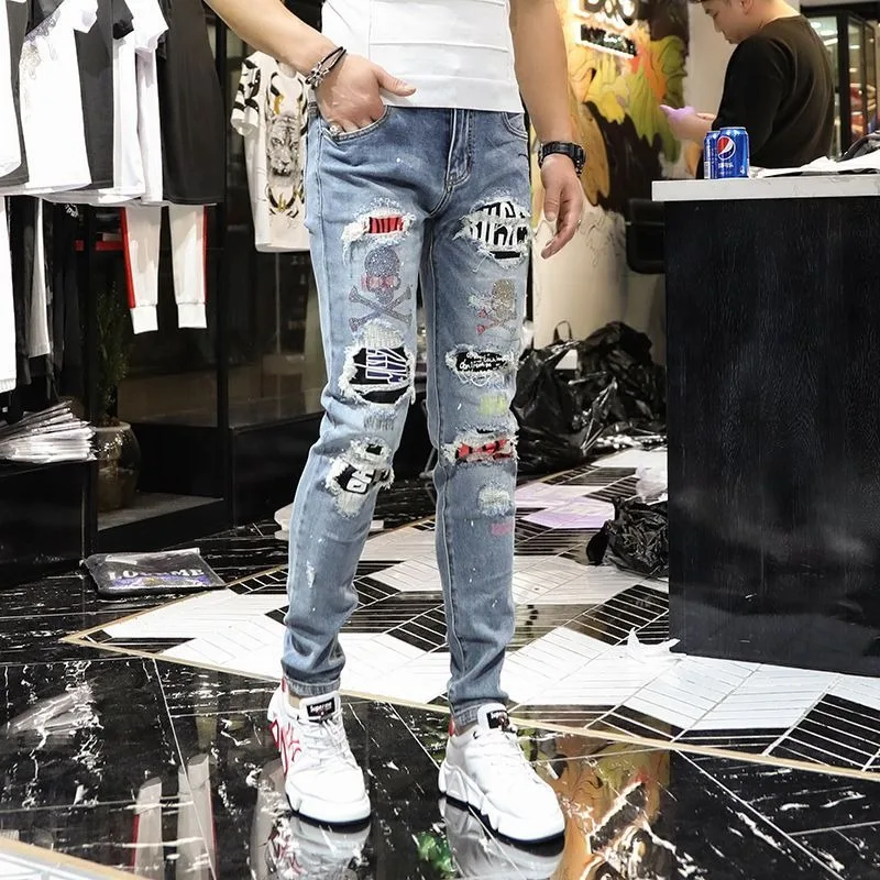 

Men's Clothing Four Seasons high quality Fashionable Distinctive Hot Drilling Skull Print Ripped Lining Slim-fit Jeans