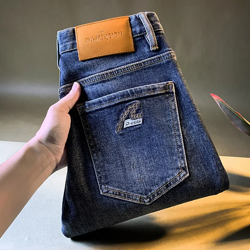 جينز رجالي راقي ملابس رجالية عصرية جينز مطاطي نمط جديد لخريف 2025 سروال أزرق غير رسمي