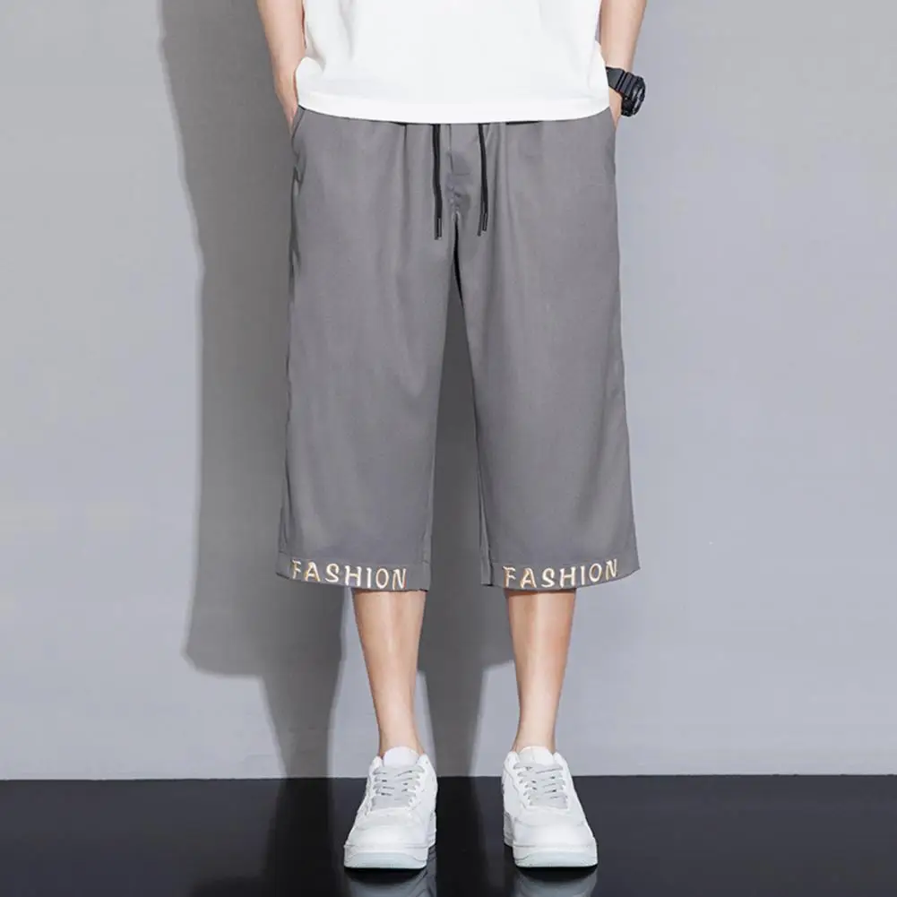 

Men Cropped Pants Stylish Men's Cropped Pants with Elastic Waistband Drawstring Featuring Letter Embroidery Print for Casual