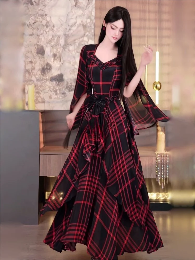 A new plaid style long dress with powerful presence featuring cinched waist and ruffled hem