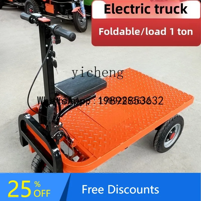 

ABB electric flatbed truck trolley site pulling goods for decoration into the elevator to pull cement yellow sand trolley