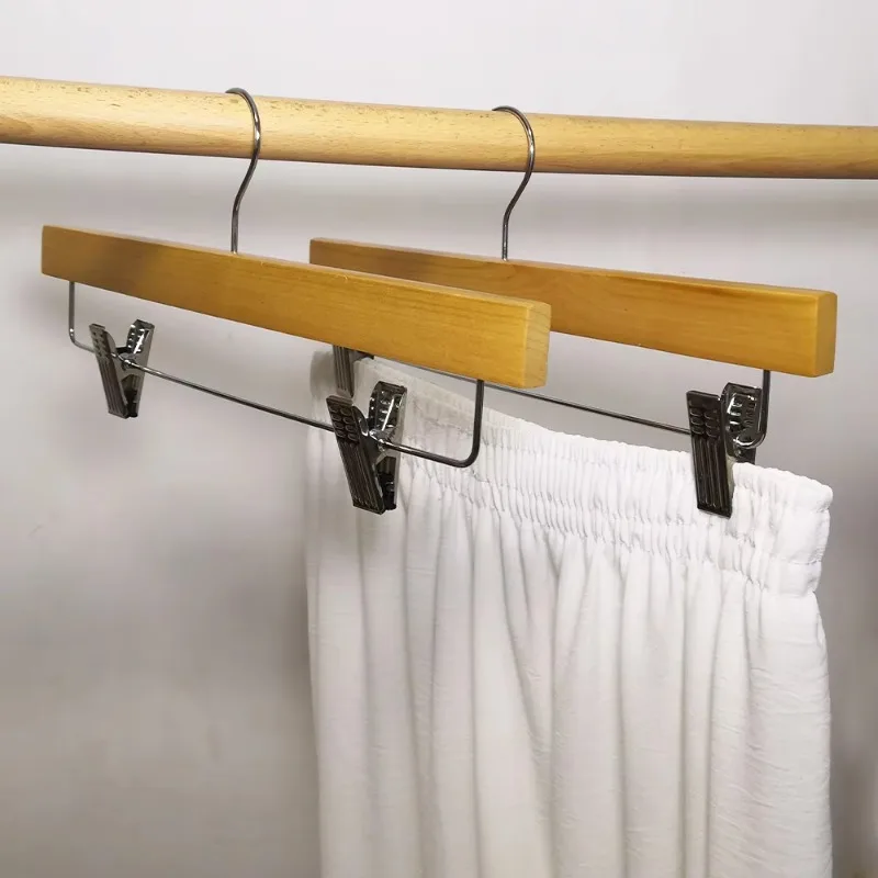 

Wholesale Hangers Factory Custom Logo Trousers Hangers Wooden Pants Hanger with Adjustable Clips for Clothing Shirt Suit Store