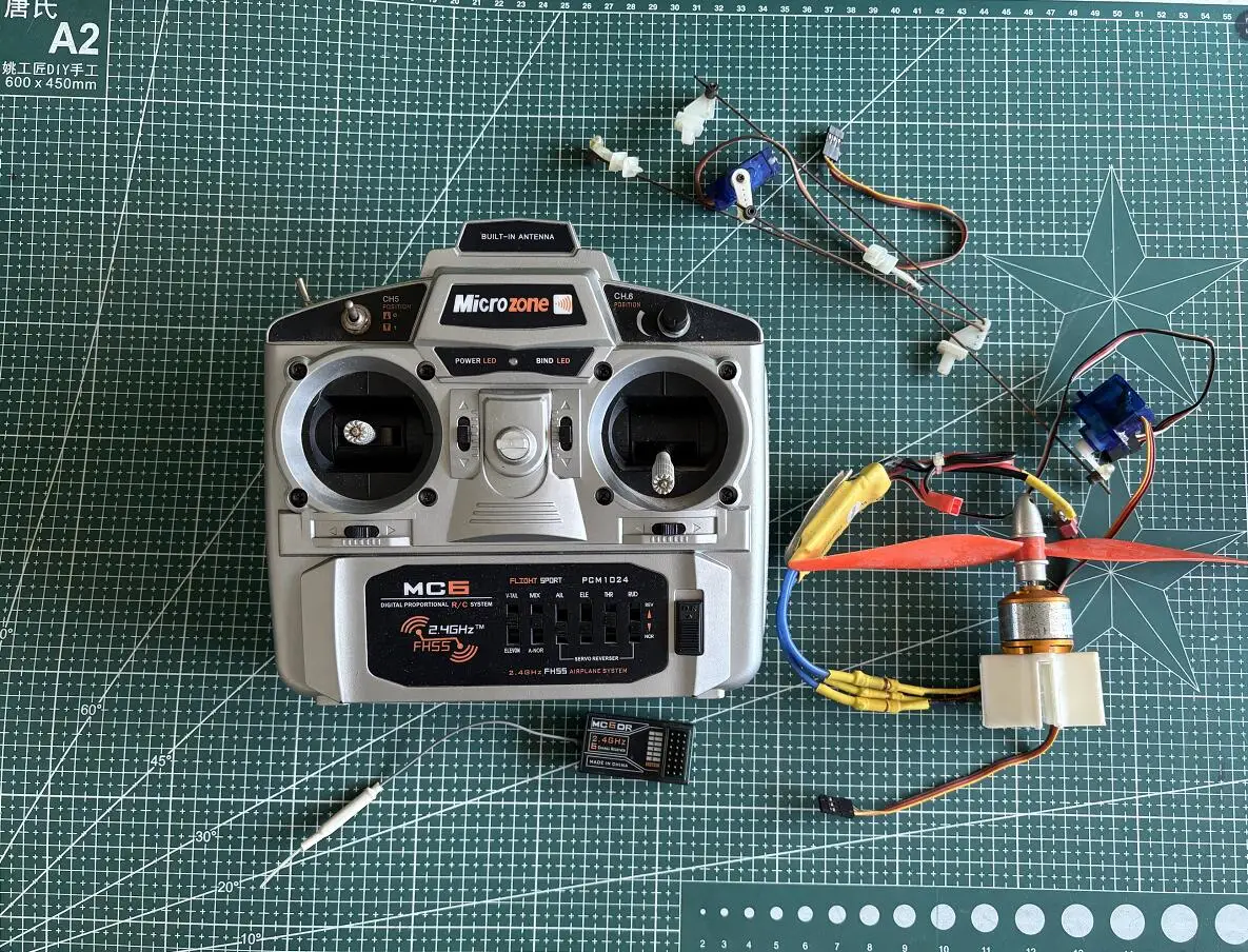 

Used Microzone MC6 6CH Radio Set 2.4GHz Transmitter + MC6DR Receiver + 2pcs 9G servos+2212 brushless motor +30A speed ESC RC KT