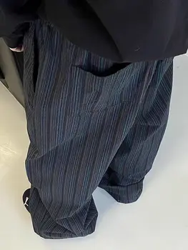 กางเกงขาม้ามีดโค้งลายแนวตั้งสำหรับผู้ชายกางเกงยาวตั้งพื้นอเนกประสงค์แบบลำลองทรงหลวมสีดำและสีน้ำเงินอเมริกาแบบย้อนยุค