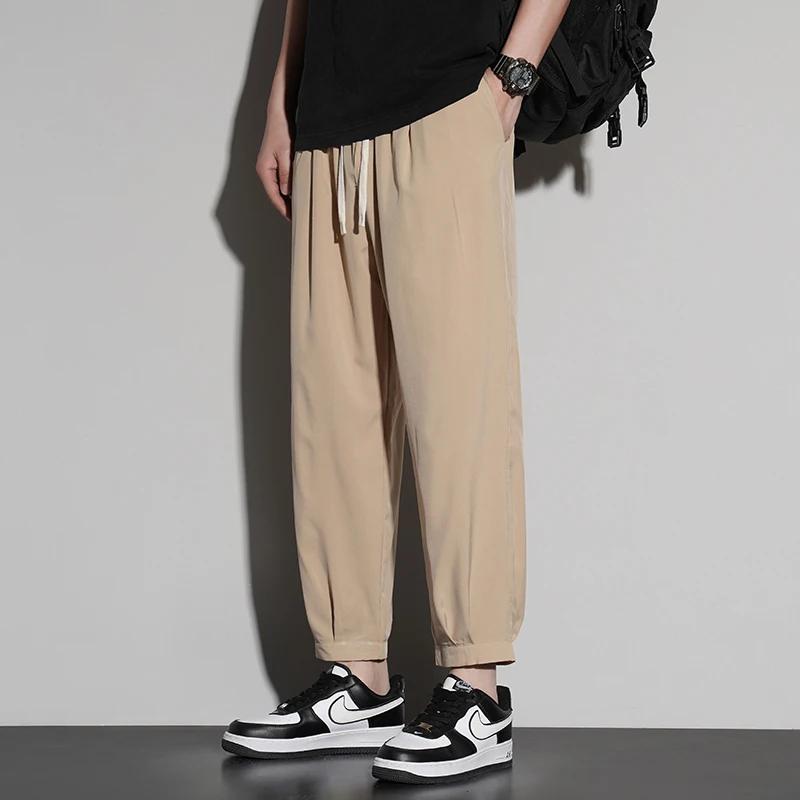 New trend summer men's solid color pocket drawstring elastic casual ice silk leggings loose wide leg cropped sports pants
