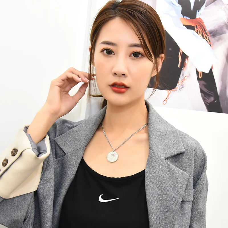 The Little Prince's round pendant necklace is a cool titanium steel hoodie chain