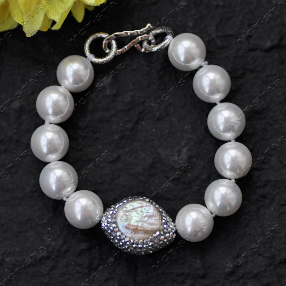 

Браслет MTC·STAR 8'' с белым круглым жемчугом-ракушкой 14 мм, инкрустированный фианитами, с жемчугом-монетой «Ангельский глаз» (Z14509)