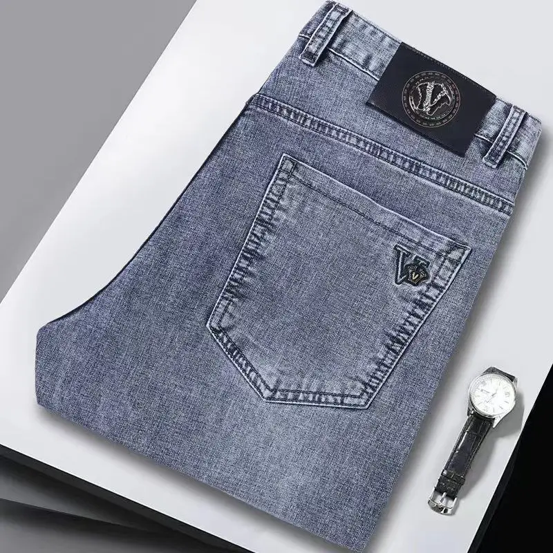 Verão calças de brim finas denim street wear masculino na moda versátil em linha reta elástica calças casuais na moda marca 2025 novas calças lavadas