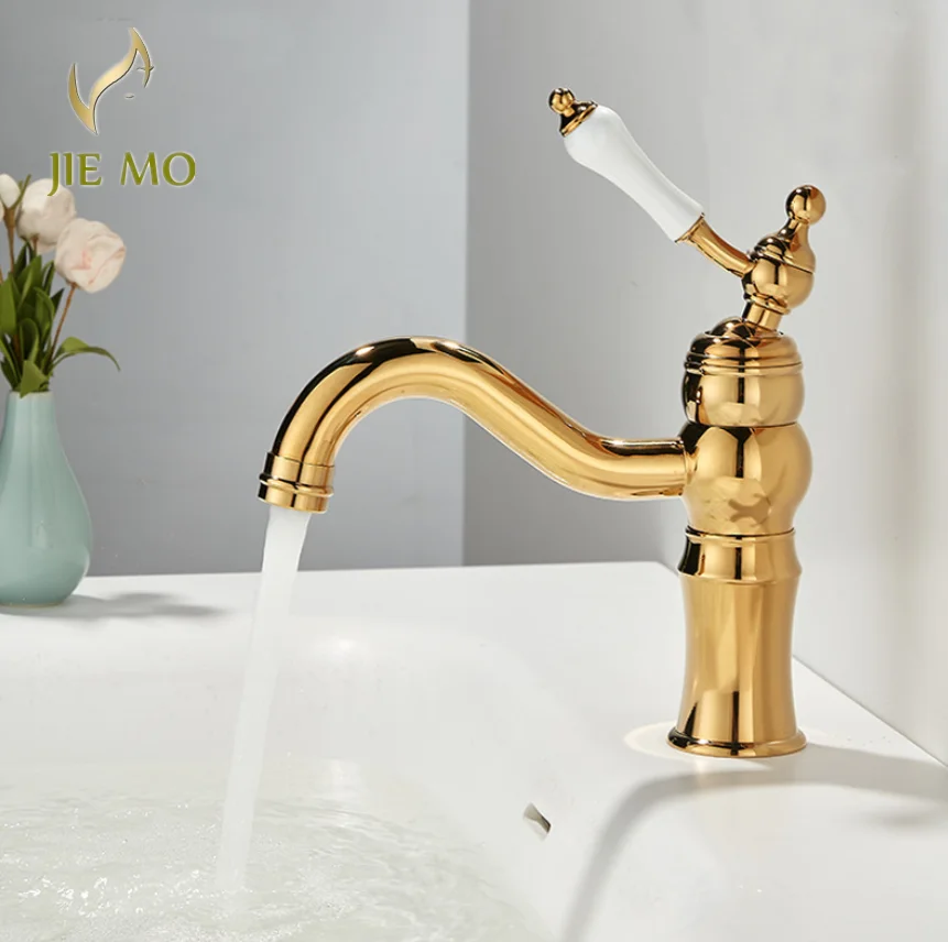 

French-style retro luxury basin faucet for bathroom. Bathroom vanity with single-hole washbasin. Brass cold and hot water faucet