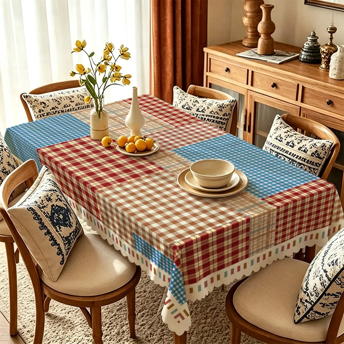 A rectangular tablecloth with a pattern of large blocks of red, blue and brown stripes in a contrasting color combination.