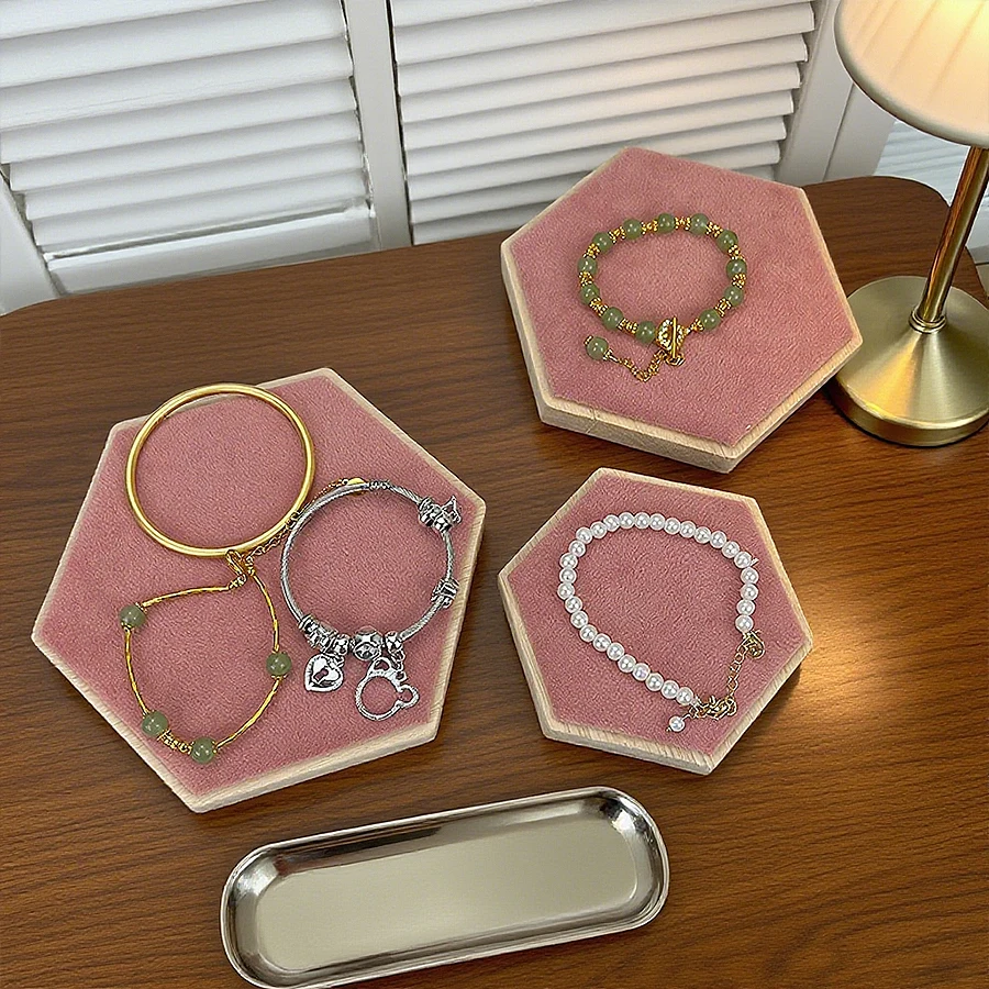 Hexagonal jewelry display stand, used for organizing and storing bracelets and necklaces.