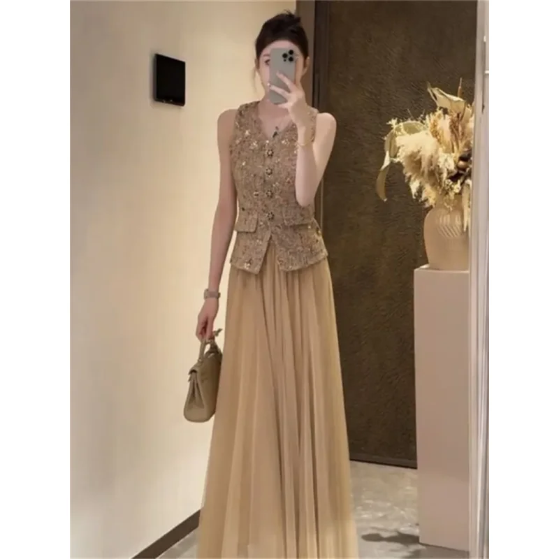 Set da due pezzi da donna francese nuova estate moda gilet sottile senza maniche con paillettes + gonna longuette a trapezio in rete piccolo abito profumato