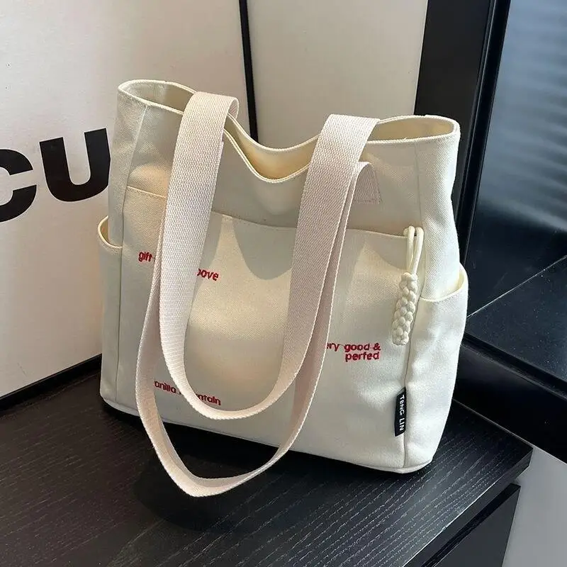 bolsa-tote-de-lona-primavera-feminina-grande-capacidade-para-o-dia-a-dia-bolsa-de-ombro-Unico-para-estudantes-moda-nova-2025