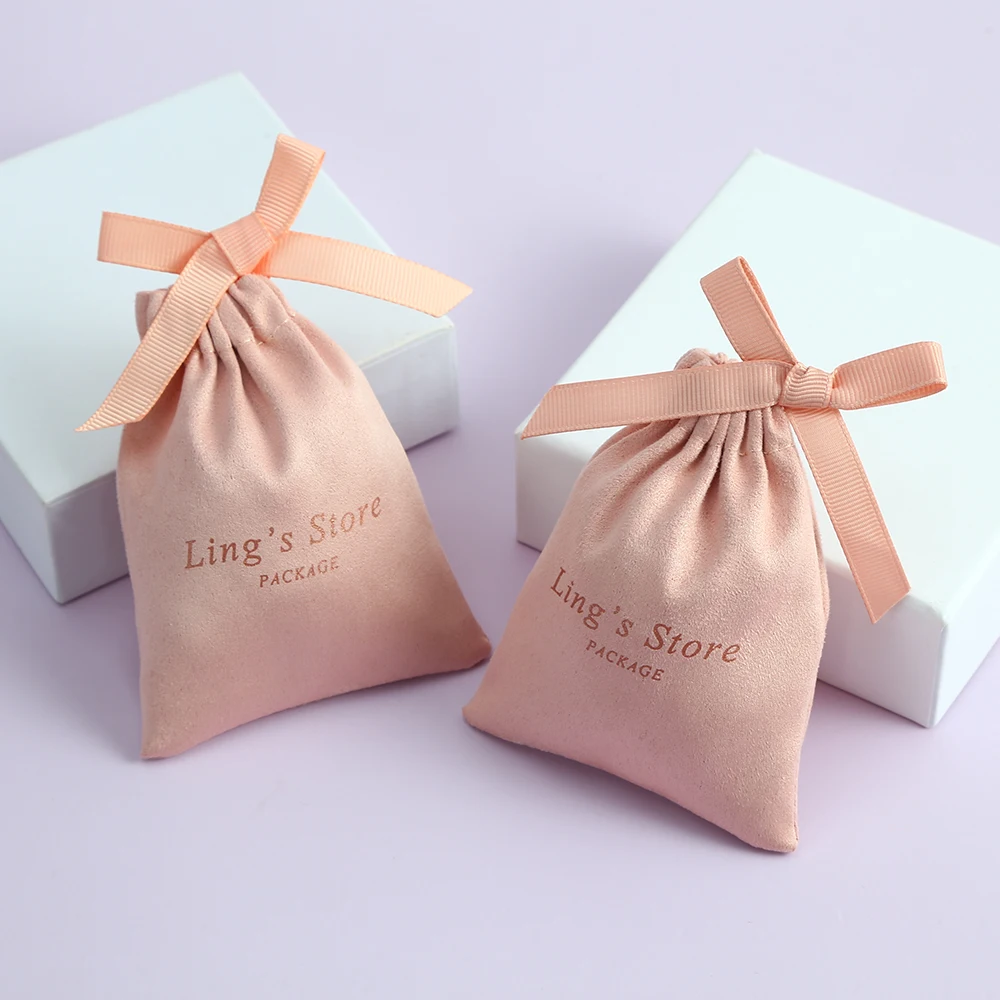 Borsa in flanella per gioielli rosa con logo personalizzato da 100 pezzi con nastro in gros-grain su un lato per custodia per orecchini portachiavi, anelli, custodia per imballaggio