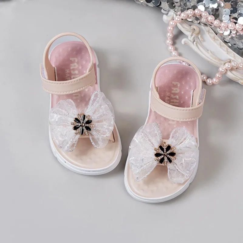 

2026 summer new girls' sandals children's soft soled open toe sandals anti slip butterfly bow princess flat beach shoes