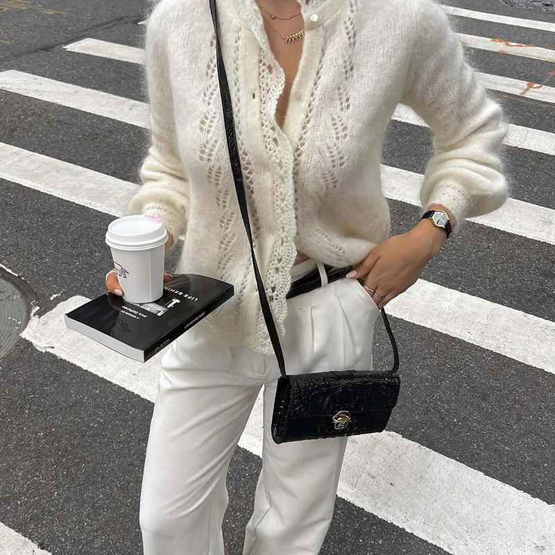 เสื้อคาร์ดิแกนไหมพรมถักลายฉลุ แขนยาว ทรงหลวม สไตล์ลำลอง ติดกระดุมแถวเดียว สีพื้น สำหรับผู้หญิง คอลเลคชั่นฤดูใบไม้ร่วง ปี 2025 รุ่น Tornova