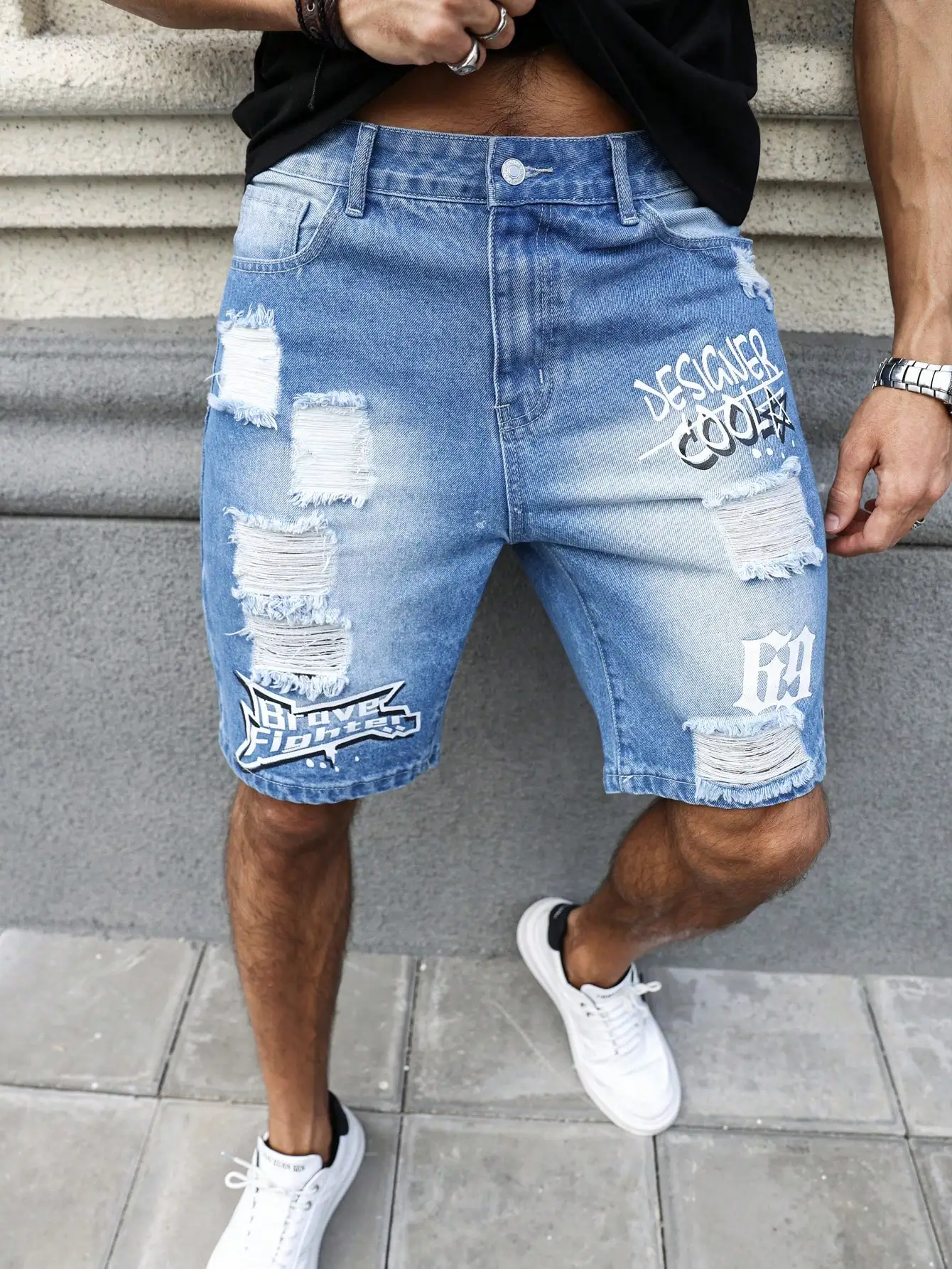 

Men's summer blue ripped printed denim shorts. Trendy ripped design. Stylish text prints.