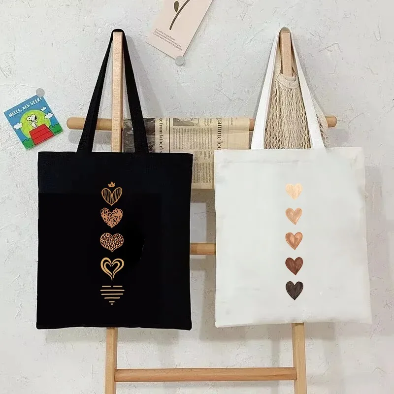

Minimalist Heart-shaped Canvas Handbag for Women Single Shoulder Shopping Bag Gold Print Black and White Color Block Design