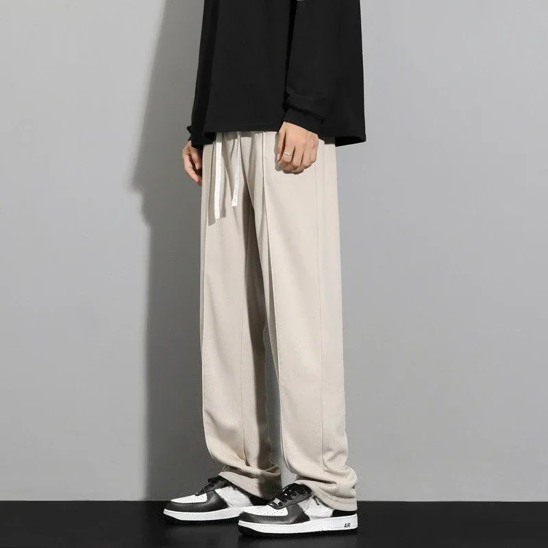 موضة صيف 2025 للرجال بنطال واسع الساق مستقيم بلون سادة غير رسمي عصري بسيط للرجال مقاس كبير بدلة أساسية وسراويل ملابس