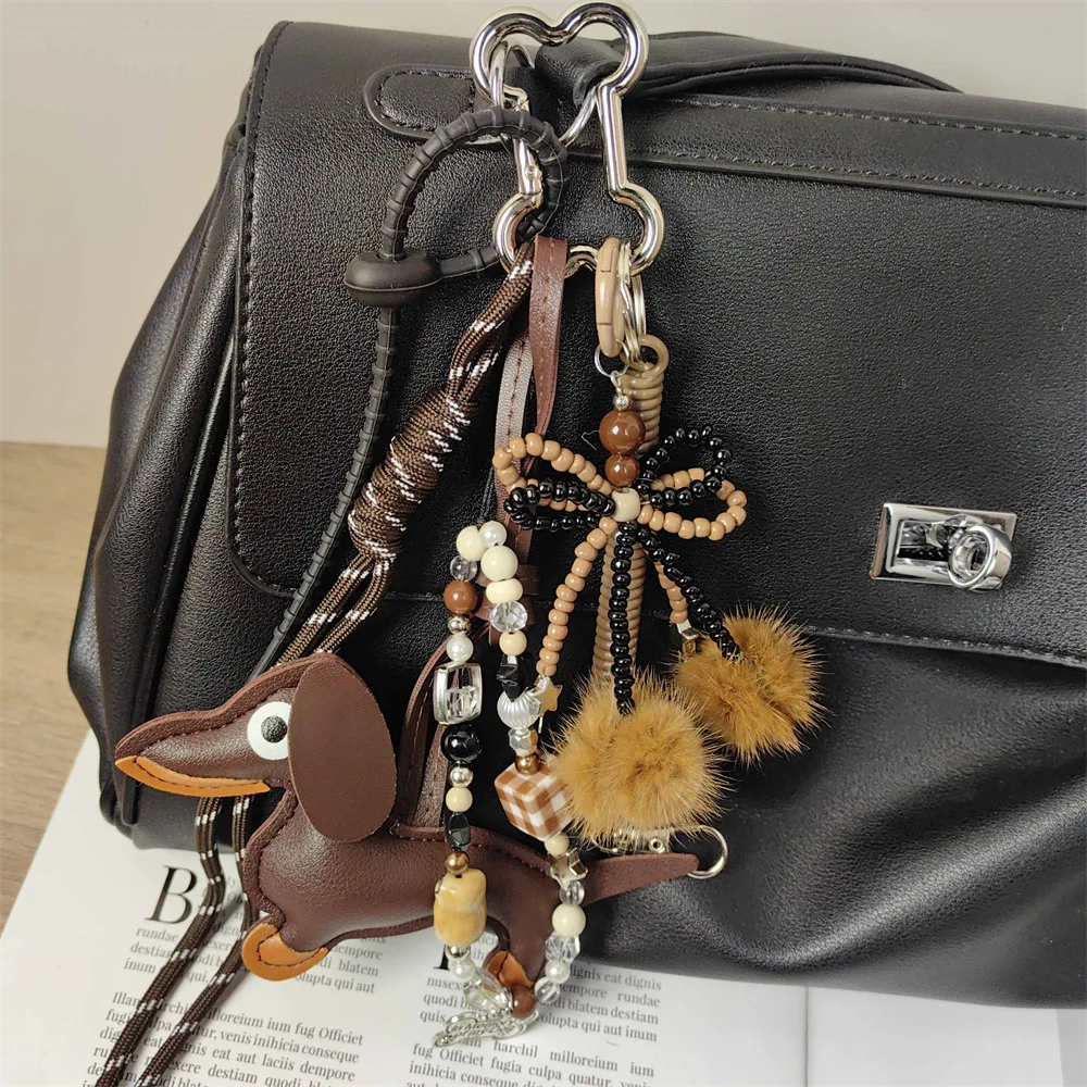 Handmade baseball personality keychain Creative simple soda bread fringe trend accessories Dachshund dog bow hairball bag pendan