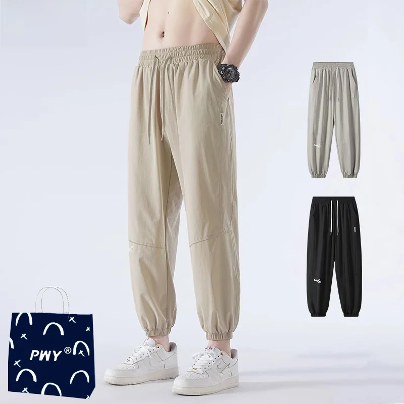 

Модные мужские летние ультратонкие быстросохнущие спортивные повседневные брюки из ледяного шелка свободного кроя, длинные брюки для кондиционированных помещений, стильные...