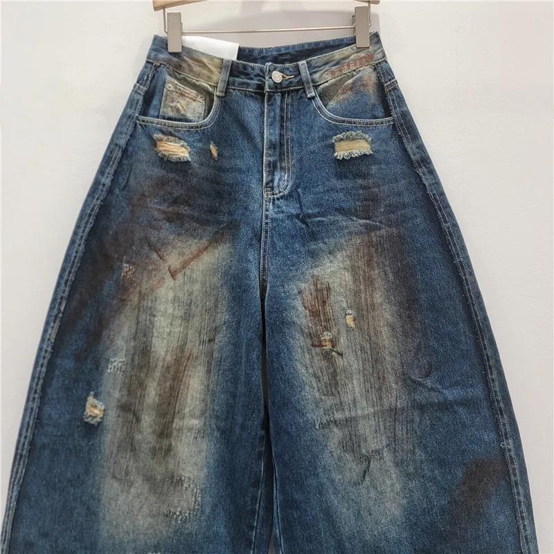 Spodnie damskie na jesień 2025, nowa moda, uniwersalne, wyszczuplające, luźne, z szerokimi nogawkami, jeansy w stylu vintage z efektem zniszczenia.