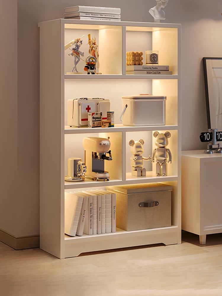 Simple toy storage multi-layer corner book cabinet in household living room with articles placed on the floor.