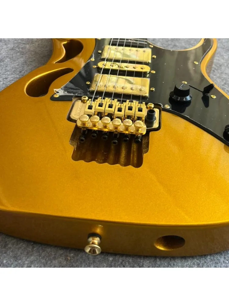 Metallisch Goldene Cutaway 7-V STS E-Gitarre mit HSH-Tonabnehmern, Ranken-Intarsien, Ebenholz-Griffbrett, Goldfarbener Hardware, Massivkorpus, Kostenloser Versand