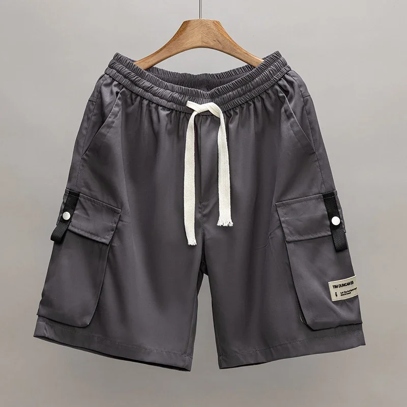 กางเกงขาสั้นทำงานทรงหลวมไซส์ใหญ่พิเศษ 8XL สำหรับผู้ชาย สไตล์เทคแวร์ กางเกงคาร์โก้ กางเกงกอล์ฟผู้ชาย มีกระเป๋าหลายช่อง กางเกงยุทธวิธี กางเกงขาสั้นลำลองฤดูร้อนสำหรับผู้ชาย