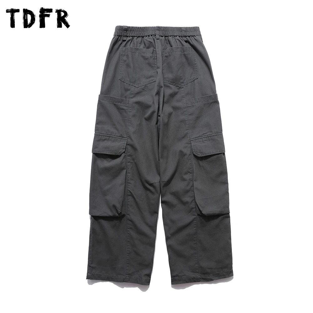 Pantalones Cargo con múltiples bolsillos para hombre, Color sólido, estilo Safari, Retro, cintura elástica, holgados, empalmados, pantalones de pierna ancha para hombre